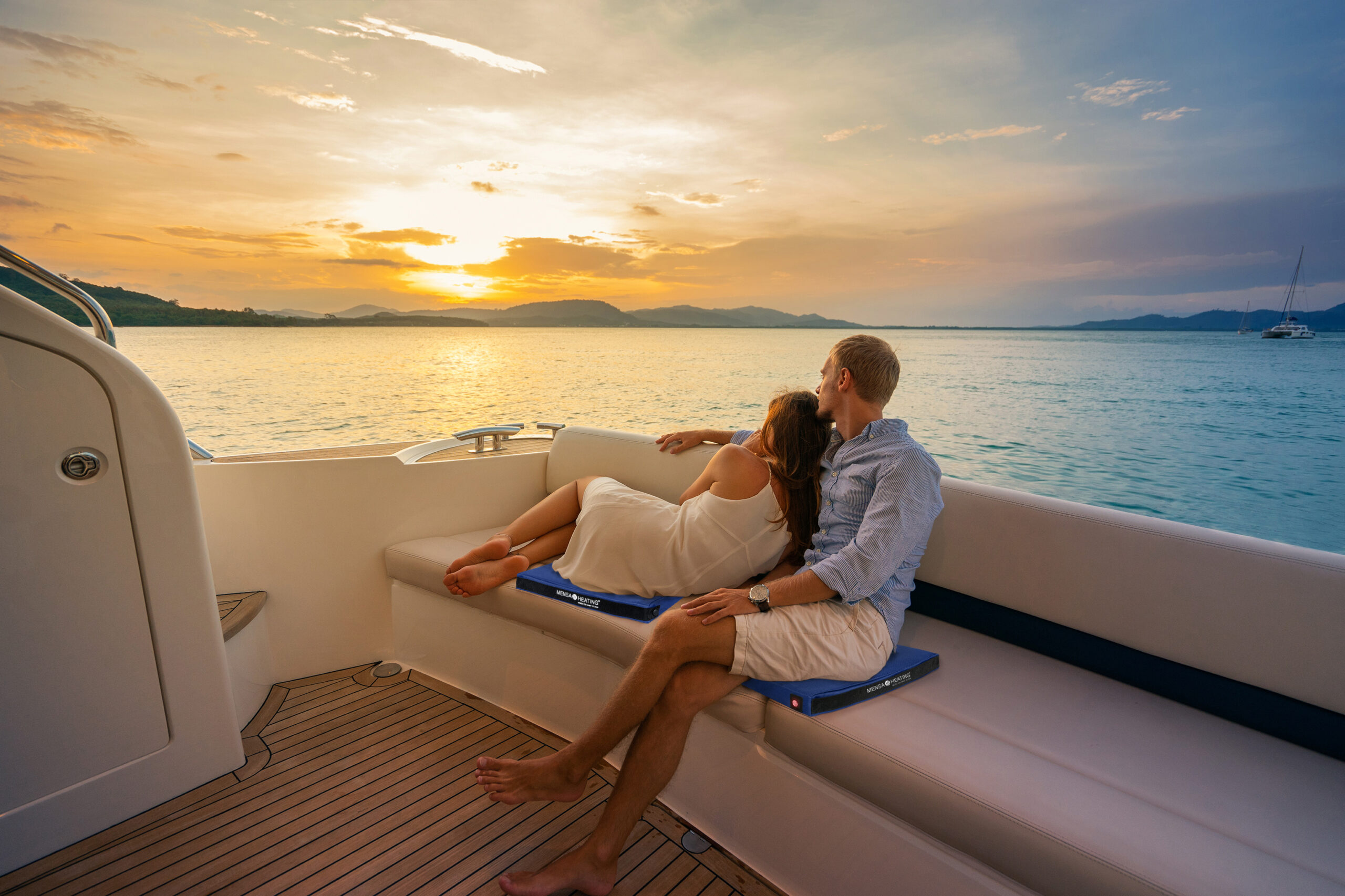Romantic vacation . Beautiful couple looking in sunset from the yacht.